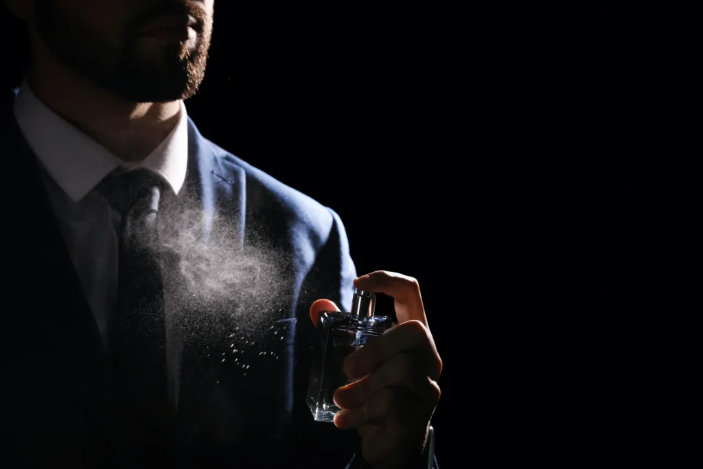 man-with-cologne-dark-background fragrance spray of edt, edp, or parfum